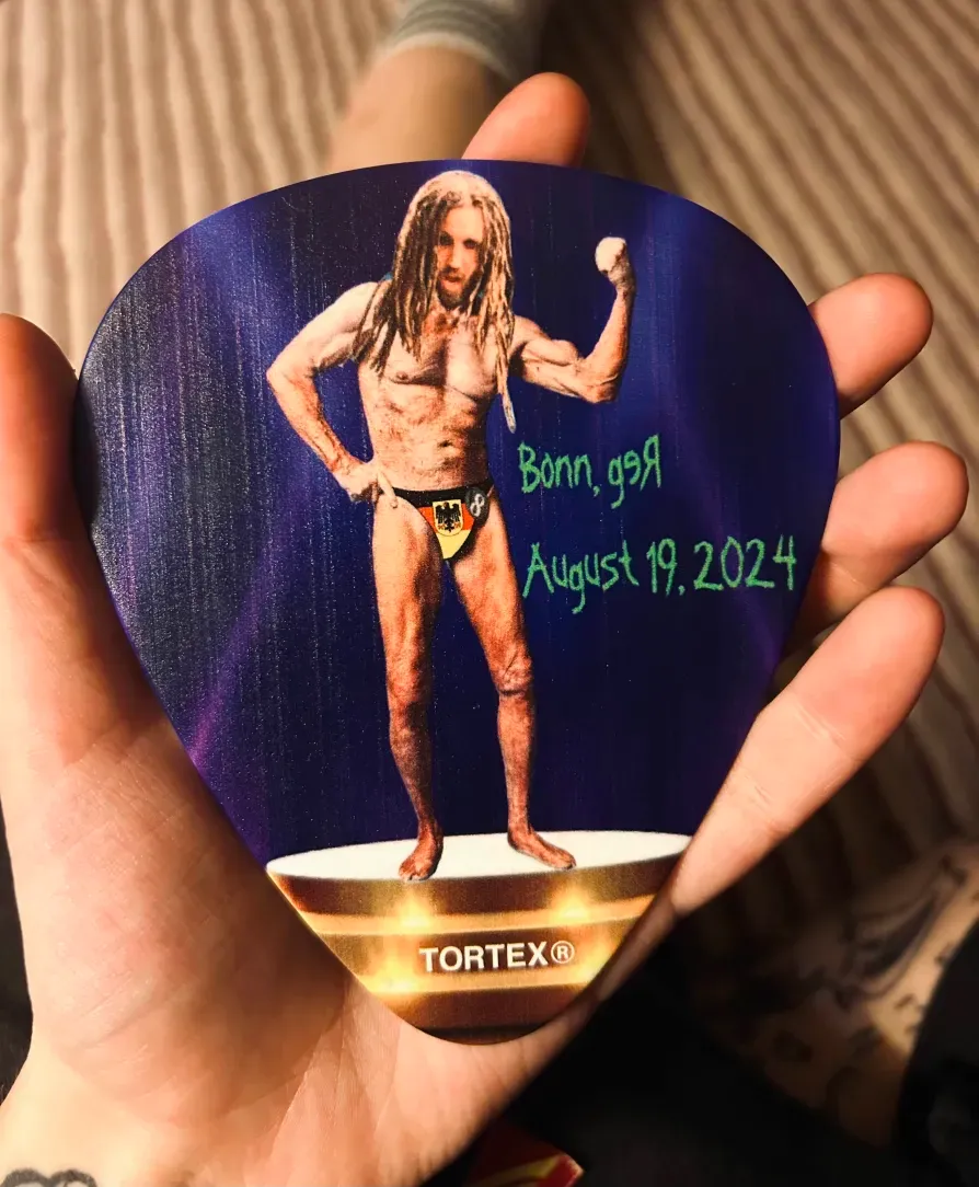 Photo of giant novelty Brian 'Head' Welch guitar pic.